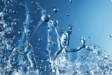 A splash of water on a blue background.