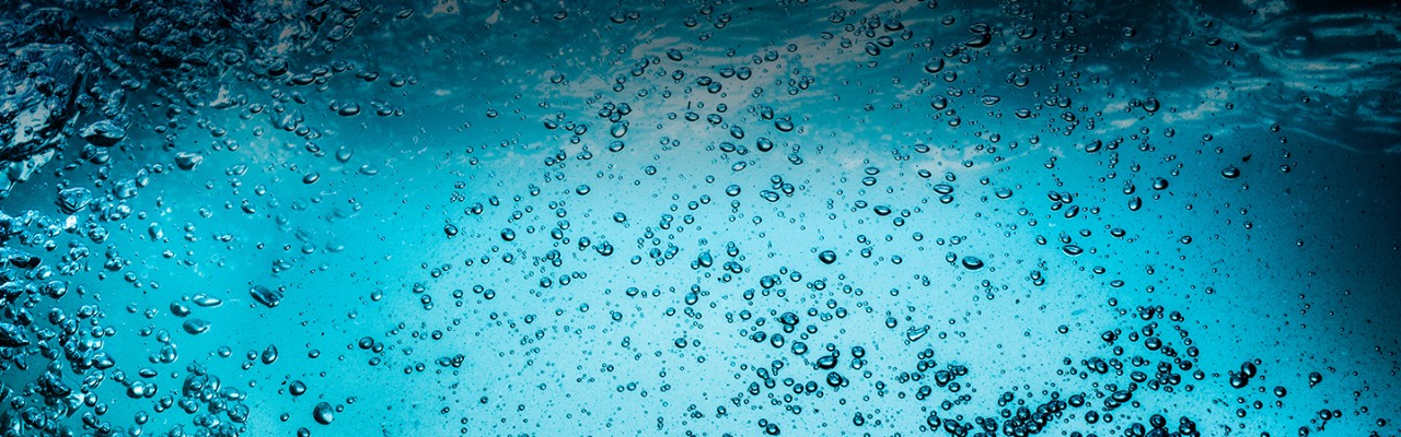 bubbles-in-clear-blue-water-close-up-horizontal-1440x450-image-file