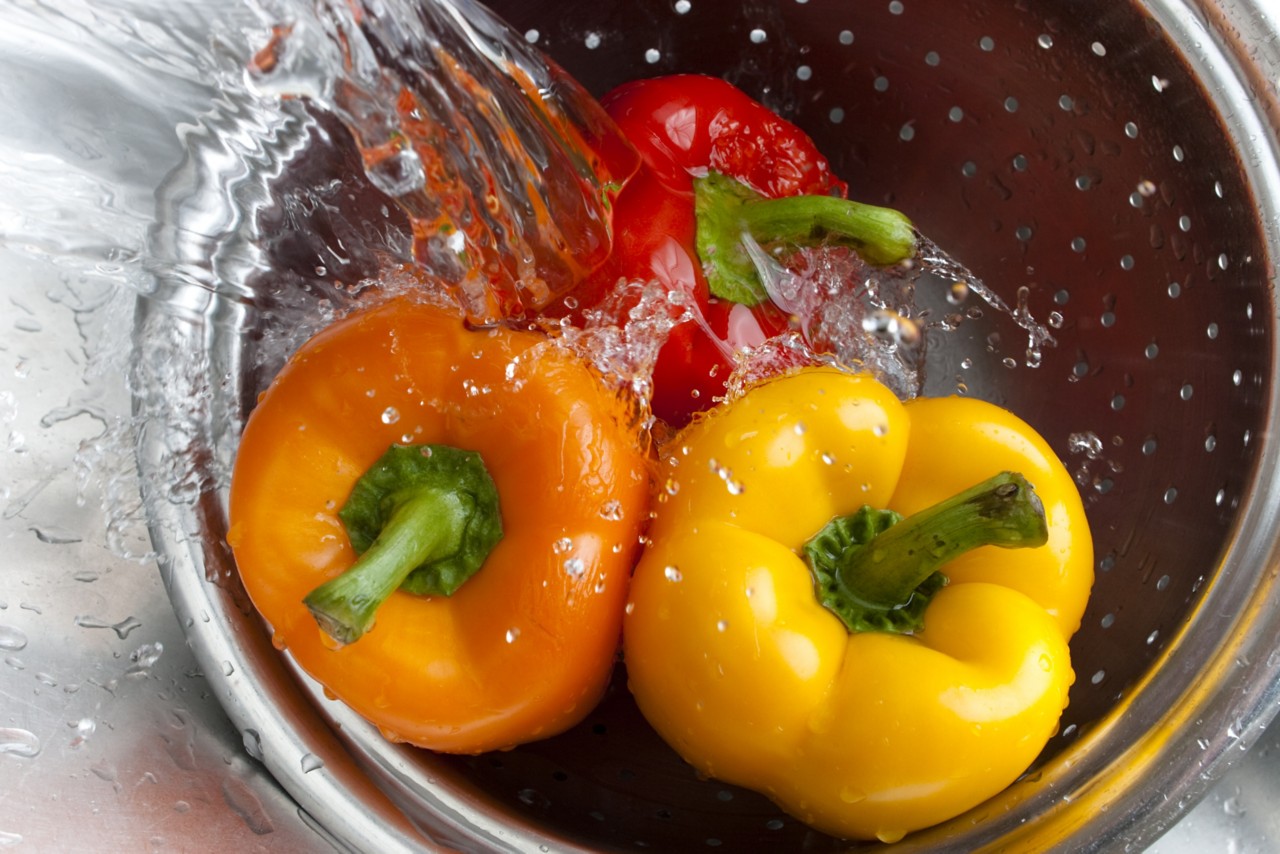 washing-peppers-in-splashing-sink-water-horizontal-3504x2336-image-file