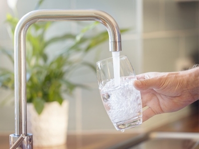 Filling glass of water at sink; Adobe Stock: 322518563